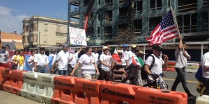 Marchers head down 13th Street for an immigration rights rally at the U.S. Capitol.