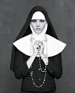 Image from Chanel's The Little Black Book featuring a model styled as a nun wearing the classic Chanel Jacket.