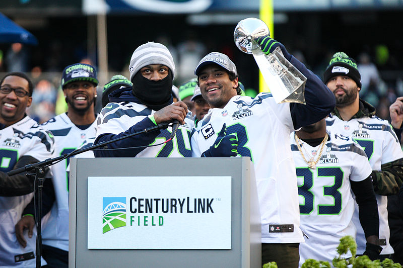 Following in Doug Williams' cleats, quarterback Russell Wilson celebrates the Seahawks' Super Bowl victory on home turf in Seattle. 