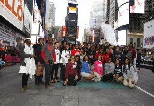 Howard University students pose in Time Square after visiting media companies in New York.